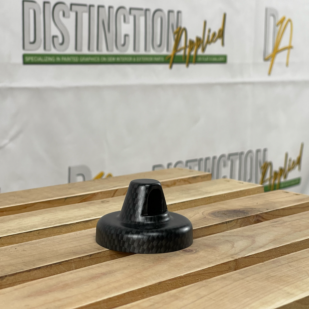 Distinction® OEM painted Antenna Cap in Rubion Gray base color and Black Carbon hydrographic on wood slates