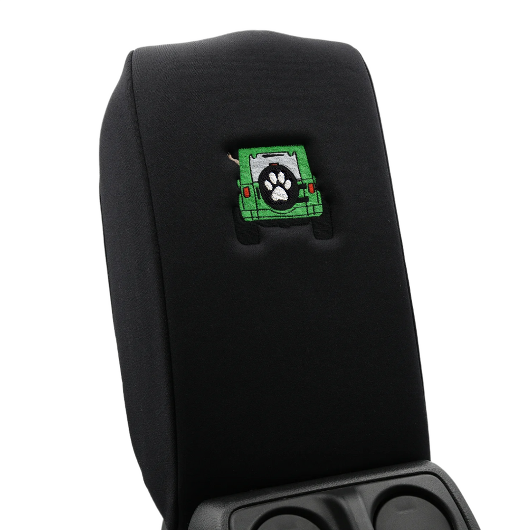 Black console cover with green color-matched Jeep rear end and black tire cover with white paw print 