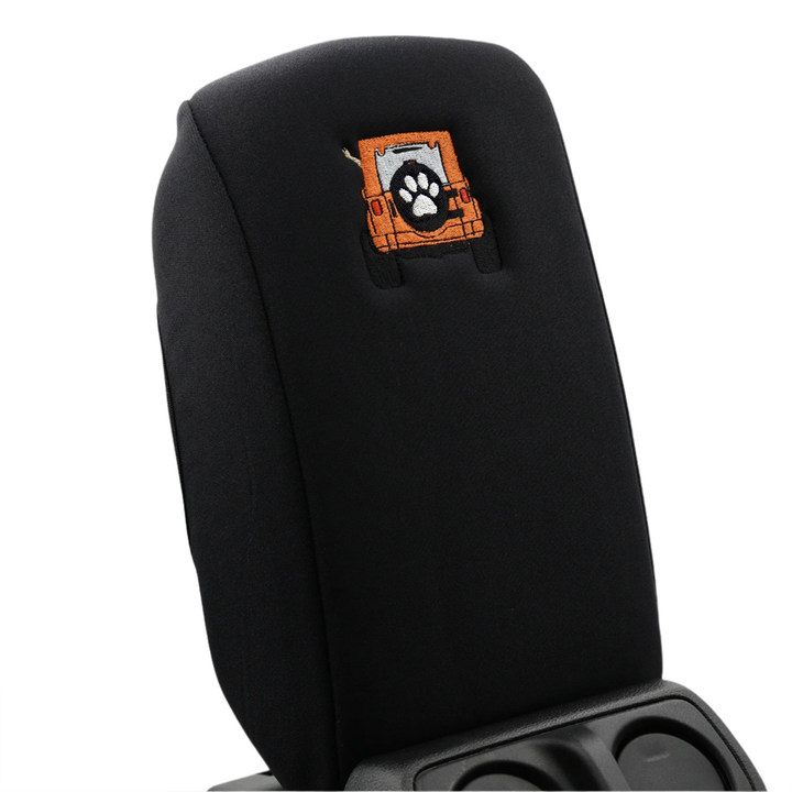 Black console cover with orange color-matched Jeep rear end and black tire cover with white paw print 