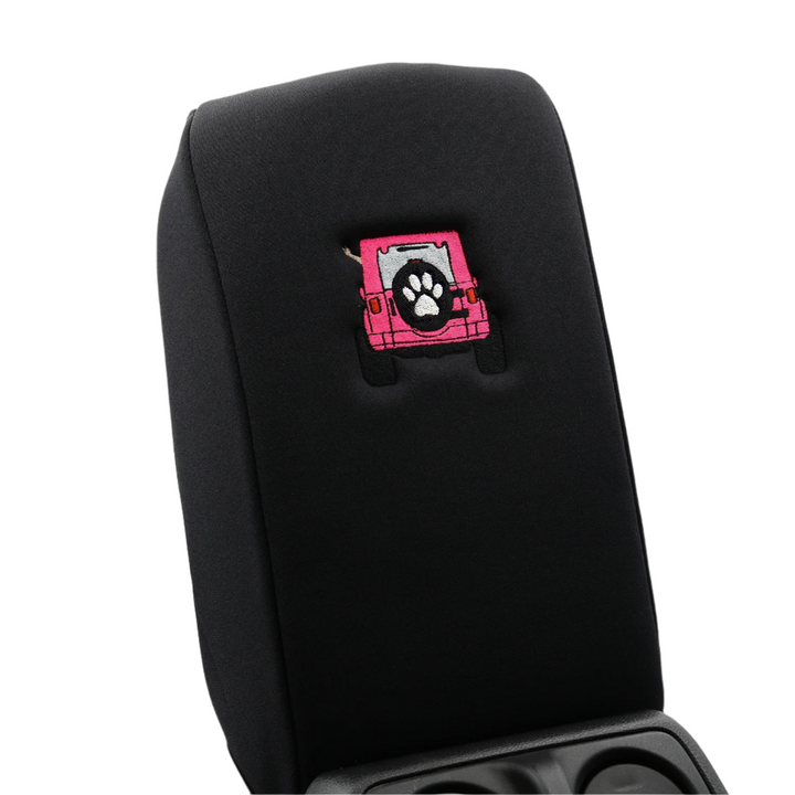 Black console cover with pink color-matched Jeep rear end and black tire cover with white paw print 