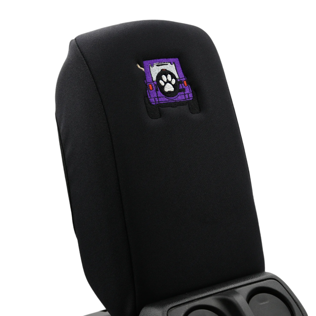 Black console cover with purple color-matched Jeep rear end and black tire cover with white paw print 