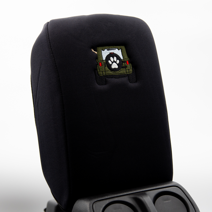 Black console cover with army green color-matched Jeep rear end and black tire cover with white paw print 