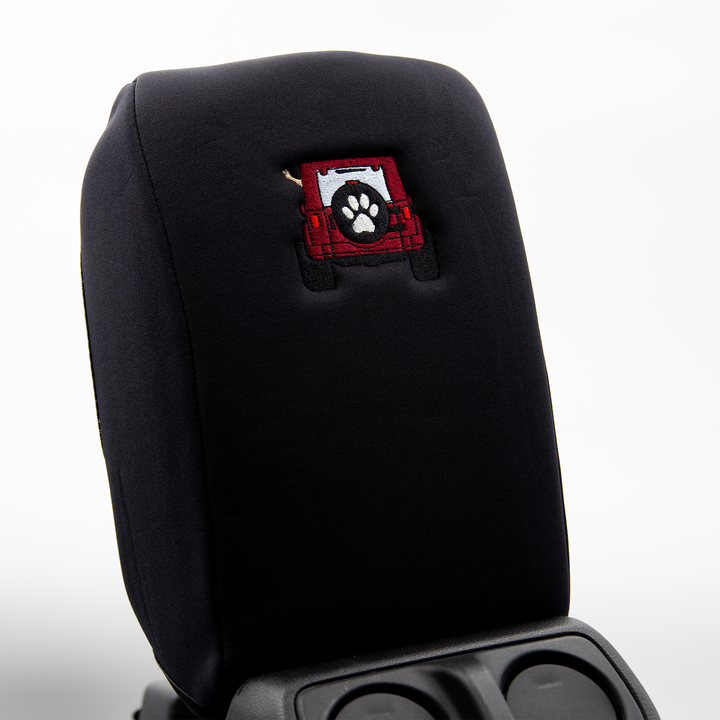 Black console cover with deep red color-matched Jeep rear end and black tire cover with white paw print 