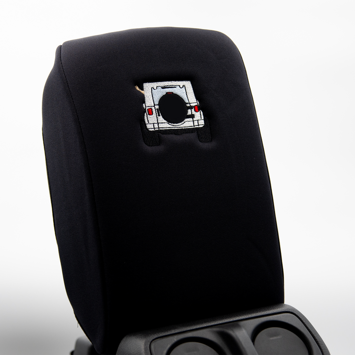 Black console cover with white color-matched Jeep rear end and black tire cover
