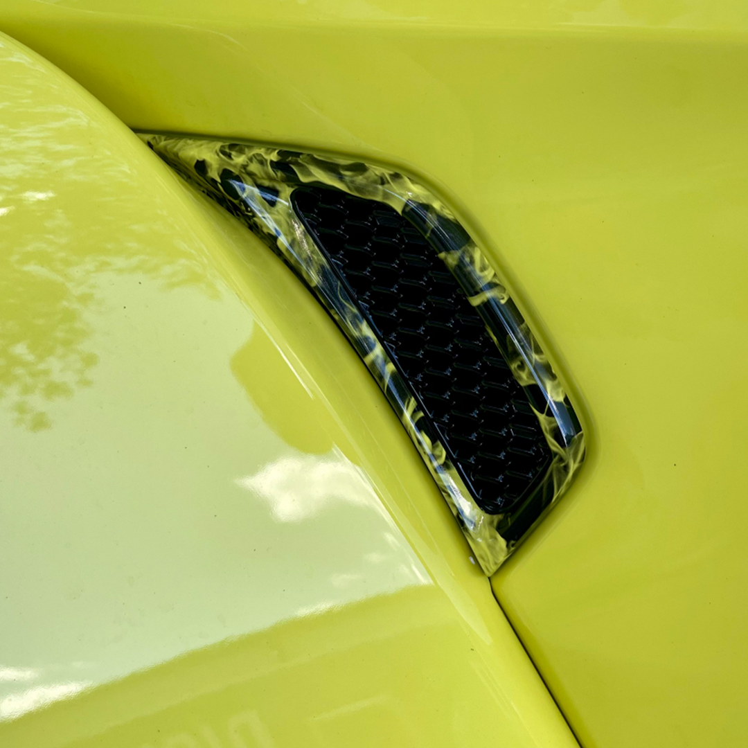 High Velocity Yellow OEM Jeep base color with Naughty Fire Hydrographic dip pattern perimeter, black inset side Fender Vents Distinction Applied