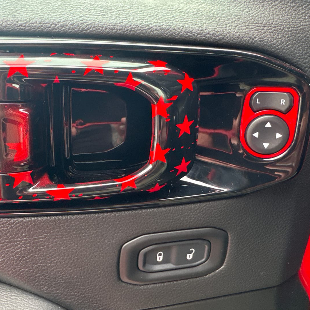 close-up of an Interior door handle release painted firecracker red with tattered flag graphic pattern 