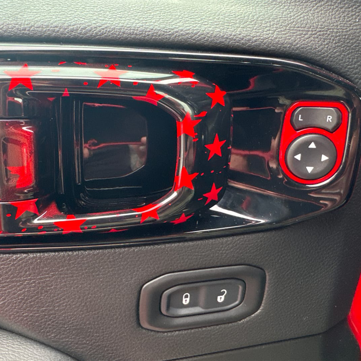 close-up of an Interior door handle release painted firecracker red with tattered flag graphic pattern 
