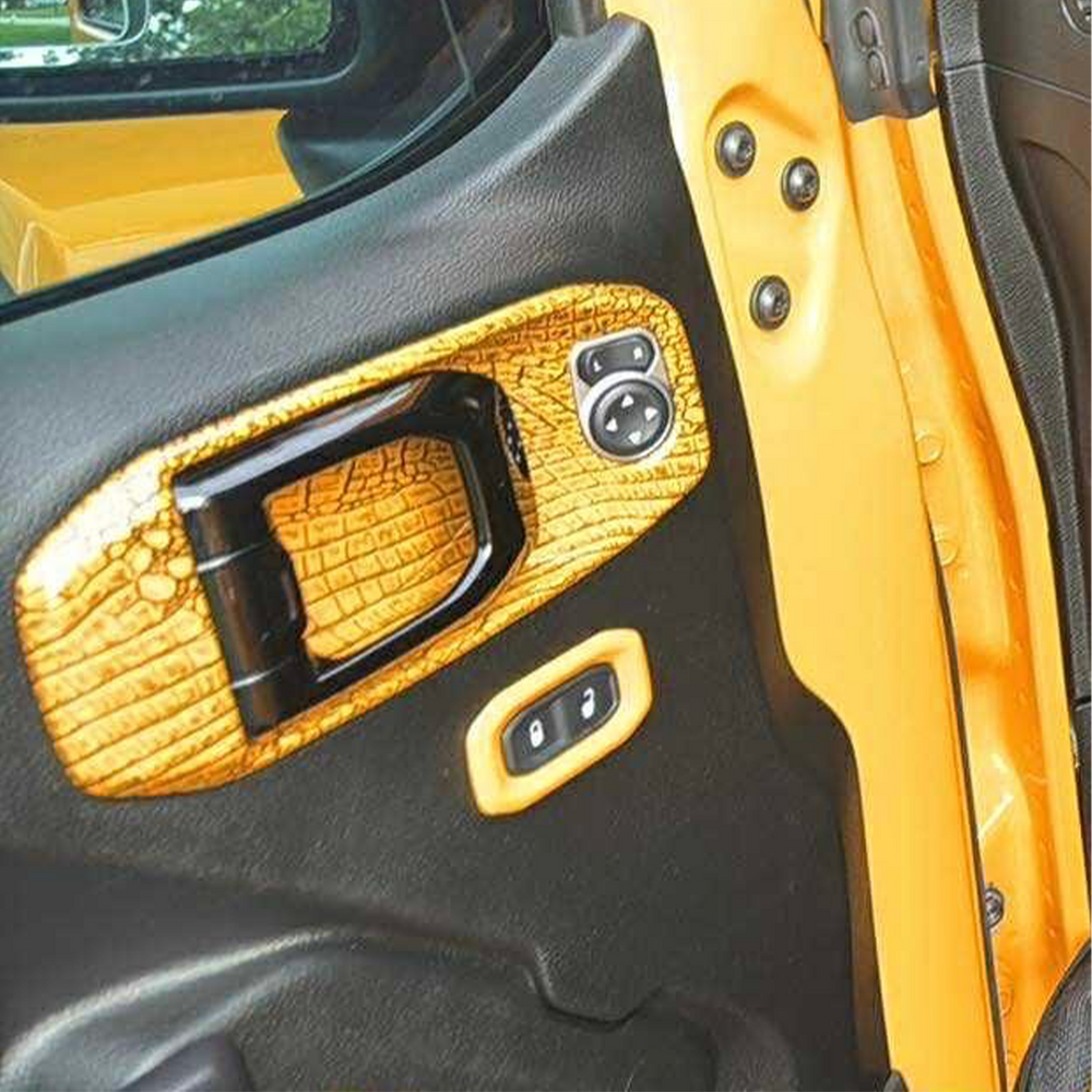 Close-up of a car lock switch panel in OEM Nacho color painted by Distinction Applied