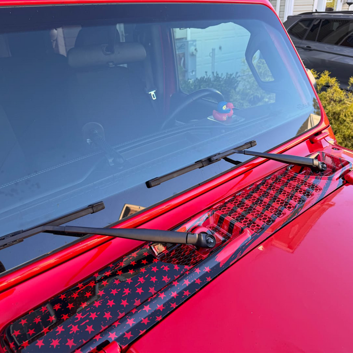Firecracker Red Jeep Wrangler with a color matched cowl wiper panel dipped in tattered flag hydrographic pattern