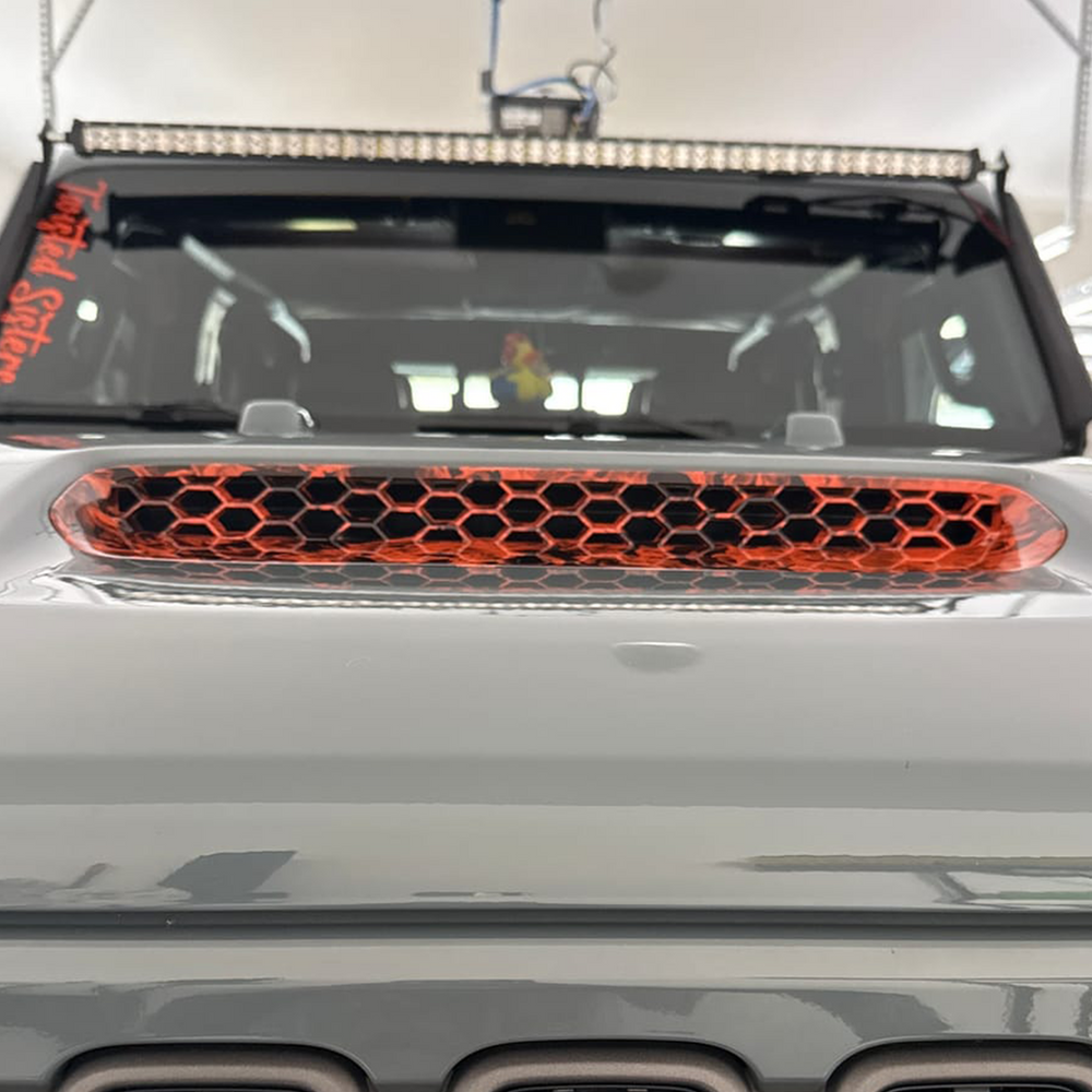 Close-up of a JT Gladiator Mojave with  Mojave orange and naughty fire graphic hood vent 