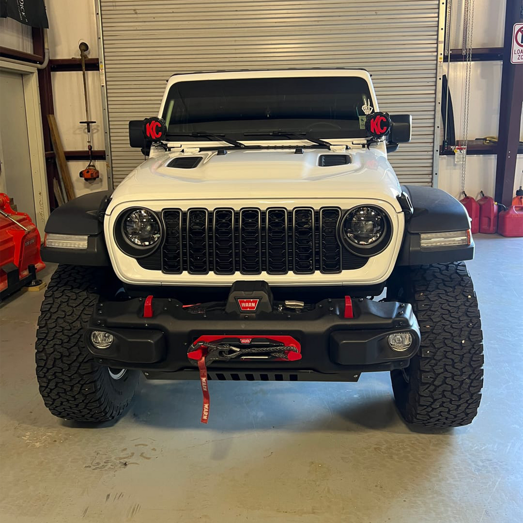 White Jeep Wrangler with '24 Aftermarket Bright White grille and black trim slot and mesh in gloss finish