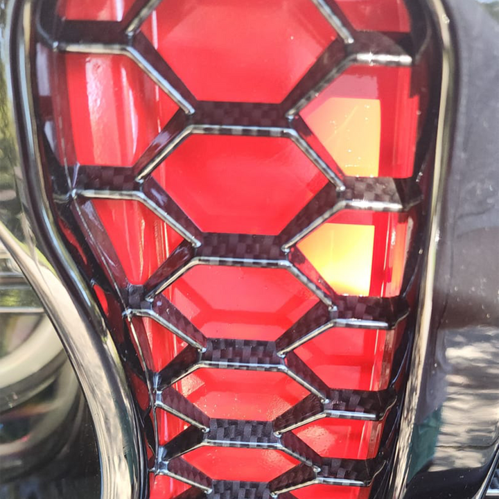 Close-up of JT Gladiator Sport Grille mesh dipped in Black Carbon Hydrographic pattern