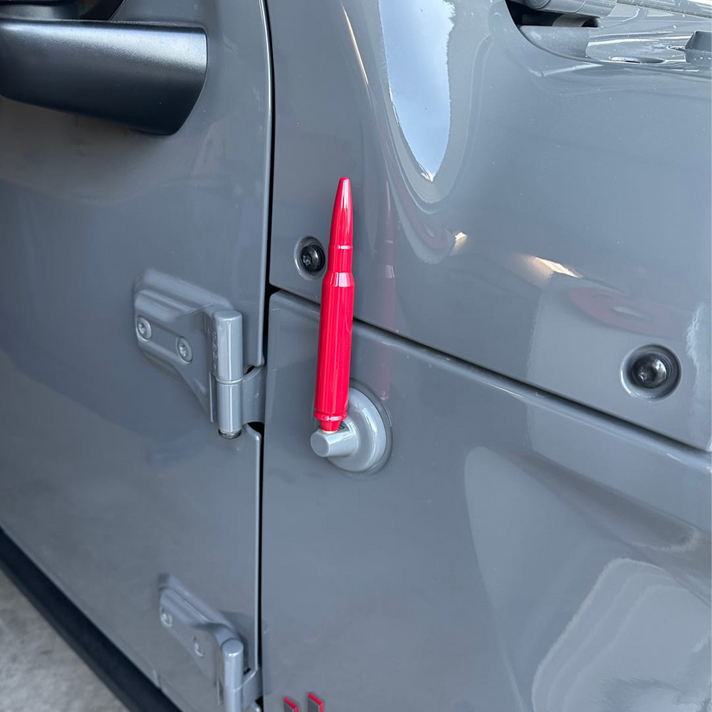 Aftermarket bullet antenna in rubicon red  with gloss finish displayed on Jeep