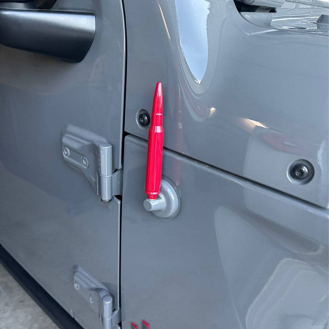 Aftermarket bullet antenna in rubicon red  with gloss finish displayed on Jeep