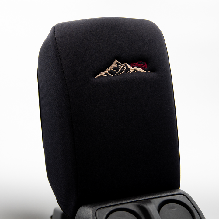 Black console cover with deep red jeep on mountain 