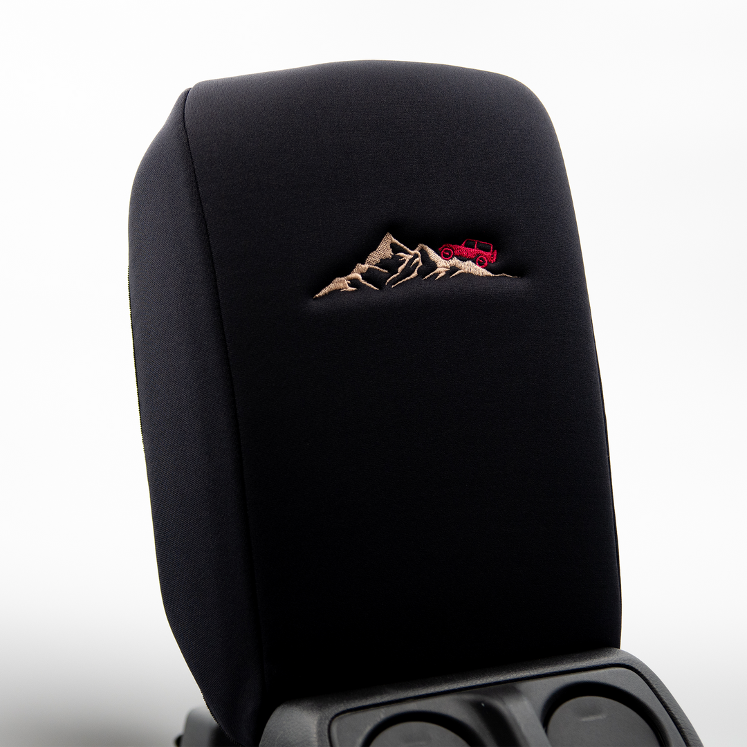 Black console cover with hot pink jeep on mountain 