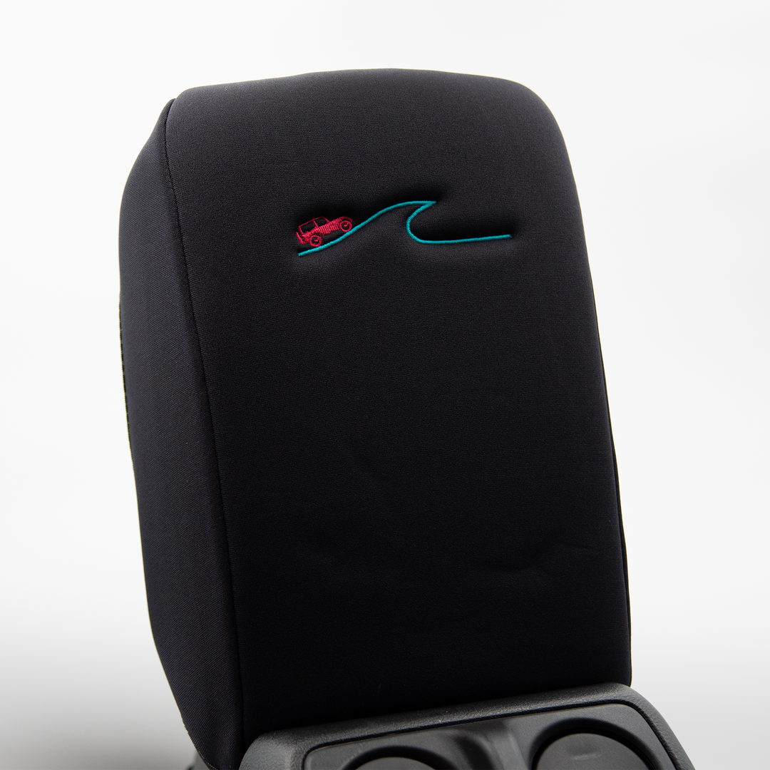 Black Armrest Cover with Hot Pink Jeep driving a blue wave