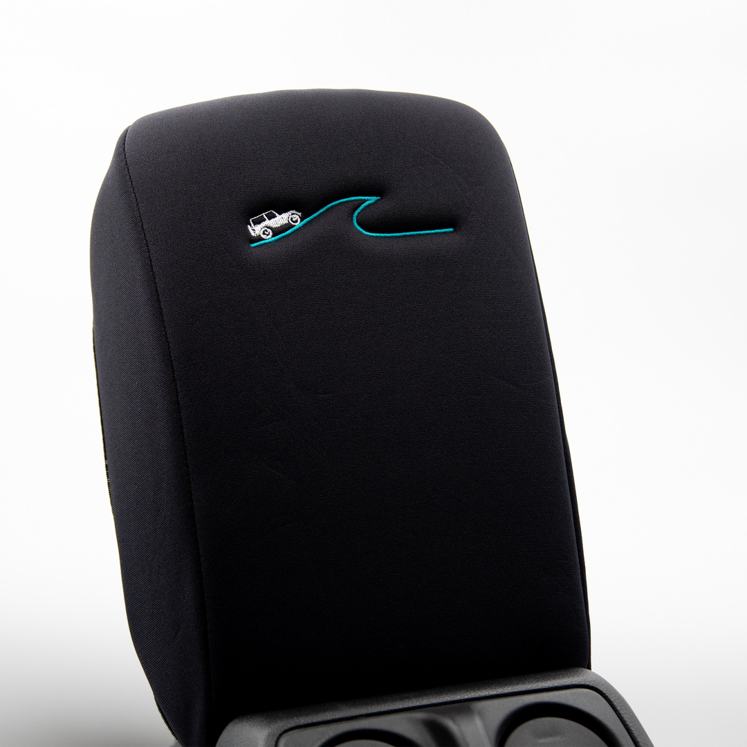Black Armrest Cover with White Jeep driving a blue wave