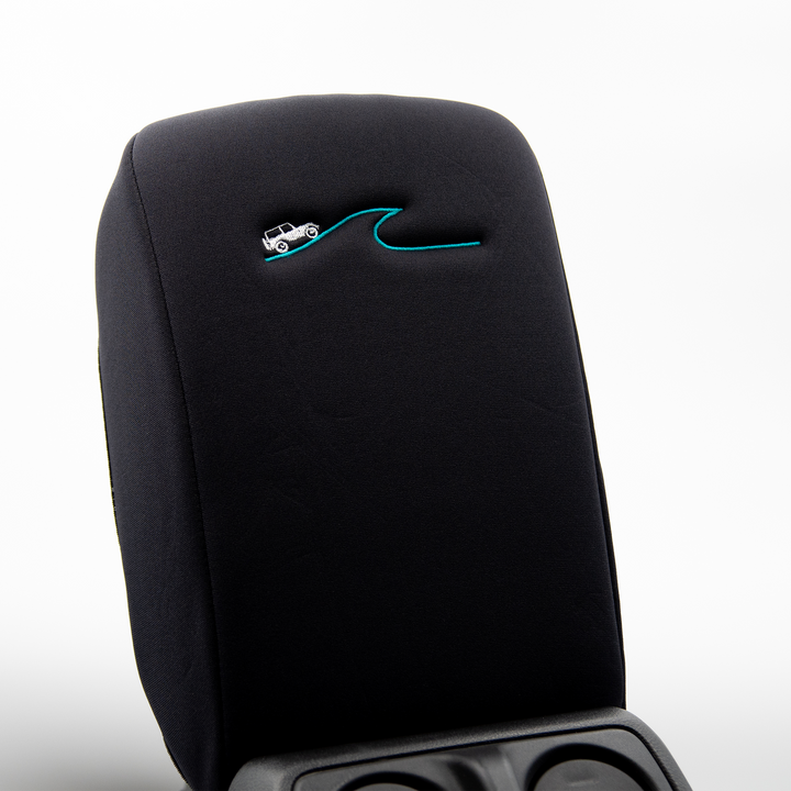 Black Armrest Cover with White Jeep driving a blue wave