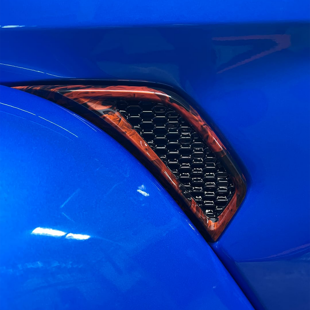 Close-up of Fender Vent Perimeter Joose/Crush base with Naughty Fire graphic and Black gloss inset 