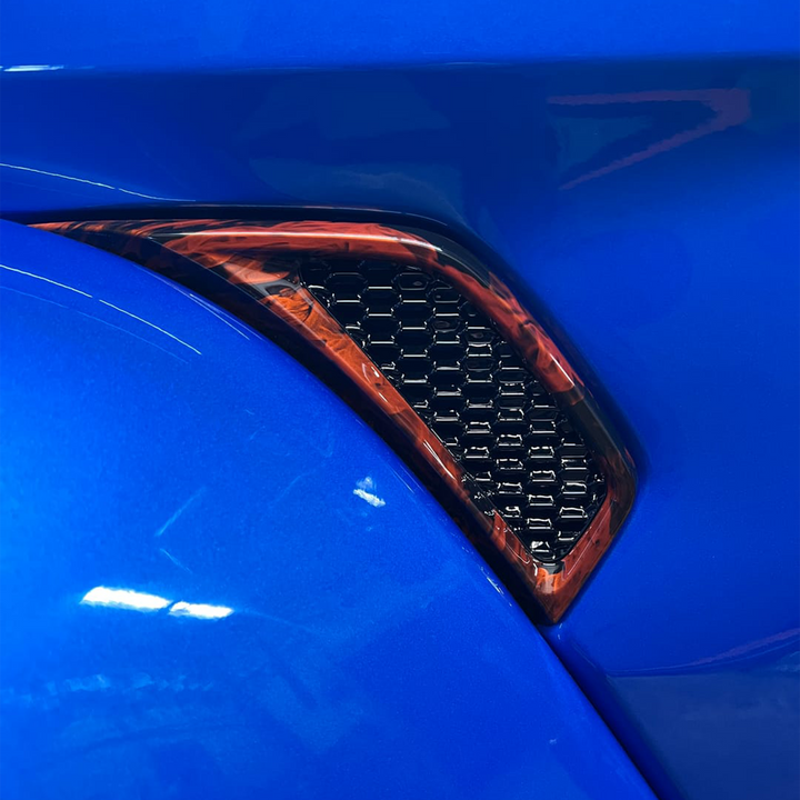 Close-up of Fender Vent Perimeter Joose/Crush base with Naughty Fire graphic and Black gloss inset 