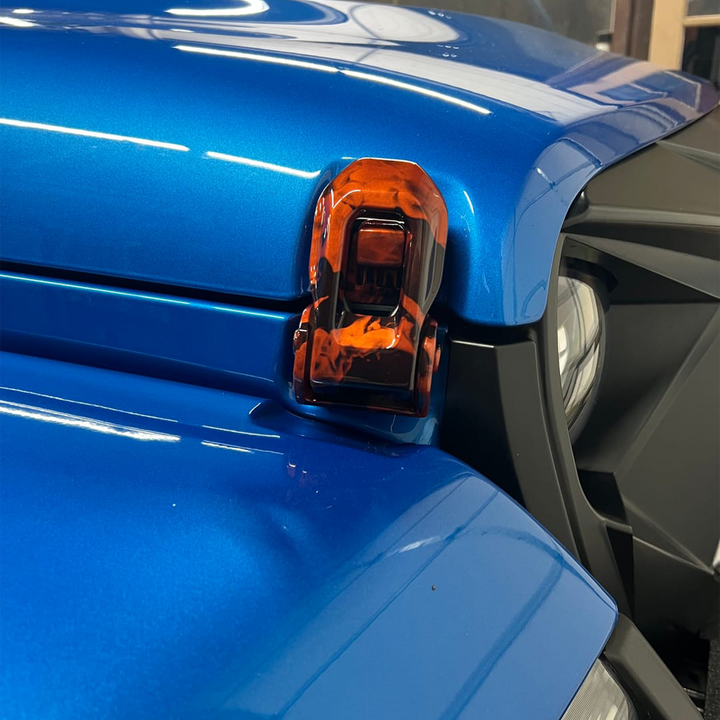 Close-up of Joose/Crush base color hood latch with Naughty Fire graphic overlay