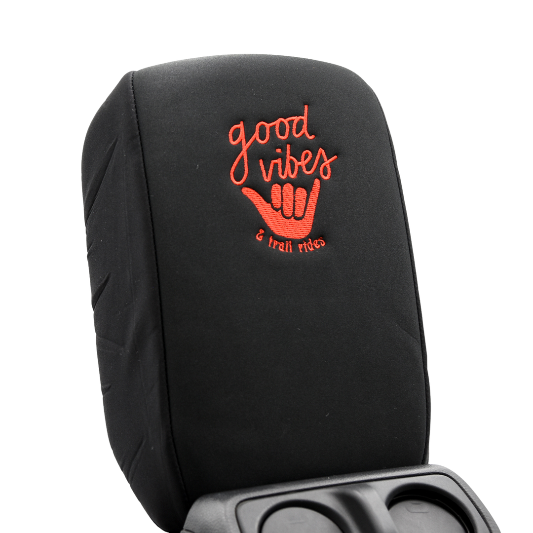 Black console cover  with red 'good vibes & trail rides' with surfer hand embroidery on a white background
